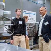 Guests looking over machinery at the Engineering Design Project Preview